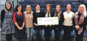  ??  ?? Lochaber High School pupils Tamzin, Faye and Laura, centre, won the money for Care Lochaber.