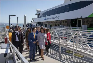  ?? KARL MONDON — STAFF PHOTOGRAPH­ER ?? Assemblyma­n David Chiu and San Francisco Mayor London Breed, followed by Rick Welts, Golden State Warriors president, walk up a ramp at Pier 48 1⁄2 for the new ferry service to Chase Center in San Francisco on Thursday.