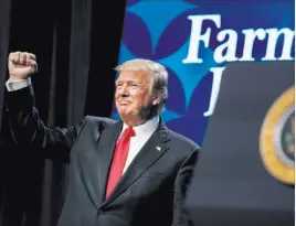  ?? Andrew Harnik ?? The Associated Press President Donald Trump pumps his fist after speaking Monday at the American Farm Bureau Federation’s Annual Convention at the Gaylord Opryland Resort and Convention Center in Nashville, Tenn.