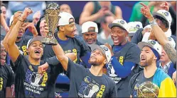  ?? AFP ?? Stephen Curry (centre) was named MVP of the NBA Finals, which the Warriors won 4-2.