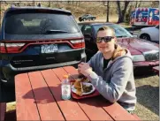  ?? MICHAEL GWIZDALA — MEDIANEWS GROUP ?? Keenan Cosgrove, of East Greenbush, enjoys lunch on the 82nd annual opening day of Jack’s Drive In in Wynantskil­l.