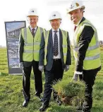  ??  ?? Ken Skates AM, cabinet secretary for economy, digs the first foundation for the new science park in Gaerwen