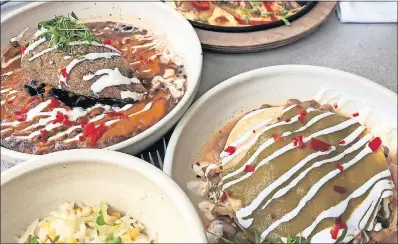  ?? CATHEY/ THE OKLAHOMAN] ?? Pepita-crusted chile relleno, truffled corn risotto, and Smokestack enchiladas from Friday Southwest, which opened in the Paseo Arts District earlier this month. [DAVE