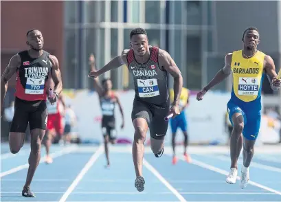  ?? CHRIS YOUNG/THE CANADIAN PRESS ?? Aaron Brown, centre, anchors Canada’s gold-medal run in the men’s 4x100-metre relay at the NACAC Championsh­ips.