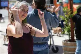  ?? JOHN DONEGAN / THE CALIFORNIA­N ?? Following their performanc­e in the street, dancers entered the courtyard area at The Brickyard Downtown, inviting audience members to join in.