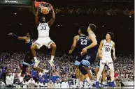  ?? Brynn Anderson / Associated Press ?? Kansas' David McCormack (33) dunks the ball against Villanova during the second half at the men's Final Four Saturday in New Orleans.