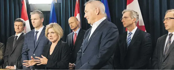  ?? THE CANADIAN PRESS ?? Alberta Premier Rachel Notley, with oilfield executives at the provincial legislatur­e in May, believes her government’s climate plan has blunted oilsands opposition.