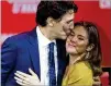  ?? COLE BURSTON / GETTY IMAGES ?? Canadian Prime Minister Justin Trudeau kisses wife Sophie Gregoire Trudeau after delivering his victory speech Monday.