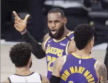  ?? AP photo ?? The Lakers’ LeBron James voices his opinion after a play in the second half of an NBA conference final playoff against the Nuggets on Saturday.