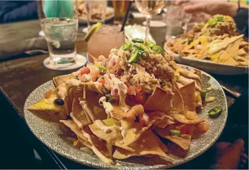  ?? STEPHEN HEARD/STUFF ?? Lobster nachos are the order of the day at The Office.
