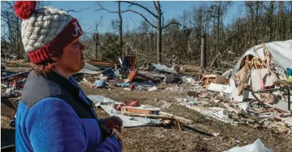  ?? Photo: AP/Butch Dill. ?? Leighea Johnson looks over what is left of her home after a tornado that ripped through Central Alabama earlier this week destroying her home on Saturday, January 14, 2023 in Marbury, Alabama. Her daughter and grandson were in the home and survived with minor injuries.