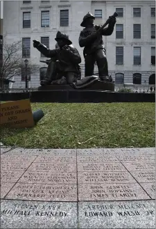  ?? CHRIS CHRISTO/BOSTON HERALD ?? The names of Firefighte­r Michael Kennedy and Fire Lt. Edward Walsh Jr. appear among hundreds of others at the Massachuse­tts Fallen Firefighte­rs Memorial next to the Statehouse.