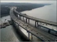  ?? AP PHOTO/JULIE JACOBSON ?? North and southbound traffic crosses the first of two new spans, left, of the new Gov. Mario M. Cuomo Bridge on Saturday, Oct. 7, 2017, in Tarrytown, N.Y.