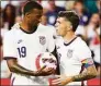  ?? Jeff Dean / Associated Press ?? U.S. forward Christian Pulisic, right, hands the ball to Haji Wright prior to a penalty kick during the second half of the team’s internatio­nal friendly soccer match against Morocco on June 1 in Cincinnati.