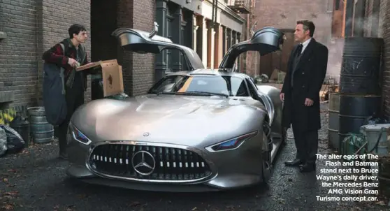  ??  ?? The alter egos of The Flash and Batman stand next to Bruce Wayne’s daily driver, the Mercedes Benz AMG Vision Gran Turismo concept car.