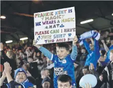  ?? ?? A young fan with a message for a Posh player! Photo: David Lowndes.