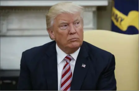  ?? EVAN VUCCI — THE ASSOCIATED PRESS FILE ?? President Donald Trump talks to reporters in the Oval Office of the White House in Washington. Trump, in an apparent warning to his fired FBI director, said Friday that James Comey had better hope there are no “tapes” of their conversati­ons.