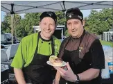 ?? BRANDY FORD
SPECIAL TO THE WELLAND TRIBUNE ?? Churchhill Meats took first place honours at the Sliderfest chef competitio­n in Fonthill on Saturday. Paul Fedj, left, and chef Raymond Haymes say the secret to their duck slider is quality meat.