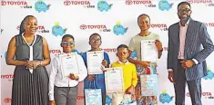  ?? ?? Head of Marketing and Communicat­ion CFAO Mobility, Miss Funmi Abiola ( left); Master Axel Davies- Tuashe, Master Oluwajuwon­lo Aletan, Master Abdulwaree­z Sulaimon, Miss Udemah Danielle and Managing Director Toyota by CFAO, Mr. Boye Ajayi during the prize presentati­on ceremony of the 17th Toyota Dream Car Art National Contest held at the Toyota by CFAO Showroom, VI, Lagos.