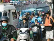  ?? TATAN SYUFLANA/AP ?? The U.N. said the world’s population will hit 9 billion in 2037. Above, traffic in Jakarta, Indonesia.