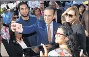  ?? Photograph­s by Allen J. Schaben Los Angeles Times ?? ANTONIO VILLARAIGO­SA and his wife, Patricia Govea, after a candidates debate at USC on Jan. 13.