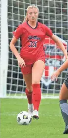  ?? OLE MISS ATHLETICS ?? Ole Miss midfielder Molly Martin (left) looks upfield in a match against Arkansas on Oct. 25. The former ECS standout registered three assists this fall for the Rebels.