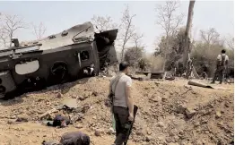  ?? — PTI ?? Security personnel inspect the site of an IED blast where nine CRPF personnel were killed and two more were injured after Maoists ambushed them in Kistaram area of Chhattisga­rh’s Sukma district on Tuesday.