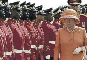  ??  ?? The queen began a two-day visit to Jamaica in 2002 with an inspection of the troops. The trip was the first stop of a 15-day golden jubilee tour of Commonweal­th nations.