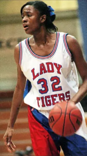  ?? Pittsburgh Post-Gazette ?? Above: As a senior in 1998, Swin Cash had one of the greatest championsh­ip performanc­es in WPIAL history with 40 points, 21 rebounds and 10 blocks. McKeesport won a WPIAL title by beating North Allegheny at Pitt’s Fitzgerald Field House. Top left: Swin Cash cut down a piece of the net after Connecticu­t won the 2002 NCAA title. Cash was named the Most Outstandin­g Player of the Final Four.