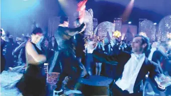  ?? Picture: Bloomberg ?? LA DOLCE VITA. Guests dance the night away at a ‘Great Gatsby’ party at the Cannes Film Festival in France. Rather than seeking ‘the sweet life’, rich South Africans seeking foreign residence status are chasing freedom to travel and to access quality...