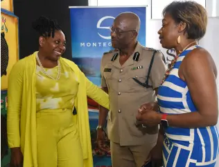  ?? ?? Janet Silvera (left), chairman and founder of Sarah’s Children, speaking with assistant commission­er of police Clifford Chambers and Dr Clover Baker-Brown, professor, Prince George’s Community College, during a special luncheon in honour of 30 women of the Jamaica Constabula­ry Force (JCF) from St James, Trelawny, Westmorela­nd and Hanover. The luncheon was held at the Roots Rock Restaurant­s, S Hotel in Montego Bay, St James, yesterday.