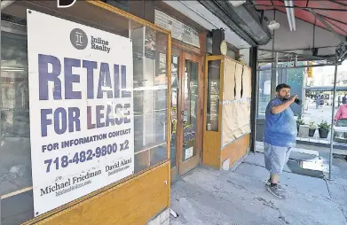  ?? ?? EMPTY FEELING: The vacant storefront left behind by a deli’s departure at the corner of East 82nd Street and Second Avenue in Manhattan is an ever-more-common sight across the Big Apple since the pandemic.