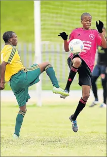  ?? Picture: SIBONGILE NGALWA ?? HI-JINKS ACTION: Mighty Swallows' Thabo Mosina, right, and Bhisho Stars' Sphamandla Sweli in a tussle during the final of the Mercedes-Benz Easter soccer tournament at Jan Smuts Stadium yesterday