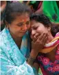  ?? — AP ?? Relatives of passengers injured in the bus accident outside a hospital on the outskirts of Mumbai on Sunday.