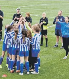  ??  ?? Horsham Sparrows under-13s lift the County Cup with coach Dave Hinchey and manager Becks Goodman proudly looking on