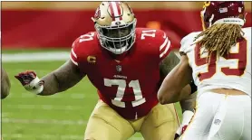  ?? RICK SCUTERI — THE ASSOCIATED PRESS FILE ?? 49ers tackle Trent Williams (71) blocks against the Washington Football Team in Glendale, Ariz., last December.