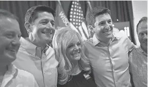  ?? SCOTT OLSON/GETTY IMAGES ?? U.S. House Speaker Paul Ryan, second left, campaigns with GOP congressio­nal candidate Bryan Steil, second right, in Burlington, Wis.