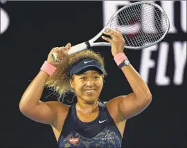  ?? Andy Brownbill Associated Press ?? NAOMI OSAKA pulled away from a 4-4 struggle in the first set to defeat former UCLA standout Jennifer Brady for her fourth Grand Slam title.