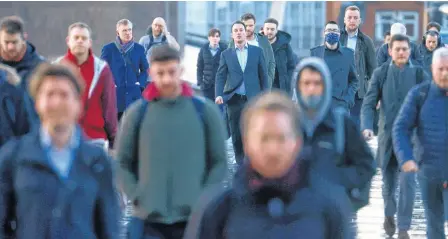  ?? REUTERS ?? People walk across London Bridge in London on Tuesday.