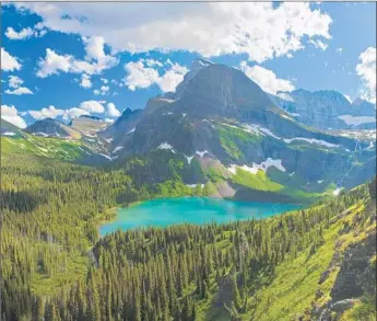  ?? Jeffrey Murray Getty Images/Aurora Creative ?? THE REWARD for veering off the expected path: Grinnell Lake in Montana’s Glacier National Park.
