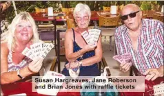  ??  ?? Susan Hargreaves, Jane Roberson and Brian Jones with raffle tickets