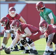  ?? NWA Democrat-Gazette/ANDY SHUPE ?? Austin Allen (green jersey) and the Arkansas Razorbacks offense will face live tackling for the first time this spring during today’s scrimmage at Reynolds Razorback Stadium in Fayettevil­le.