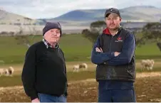  ?? PHOTO: ANDY ROGERS ?? CHECK THE FINE PRINT: Shane Trotter and his father Graham had 148 head of sheep stolen.