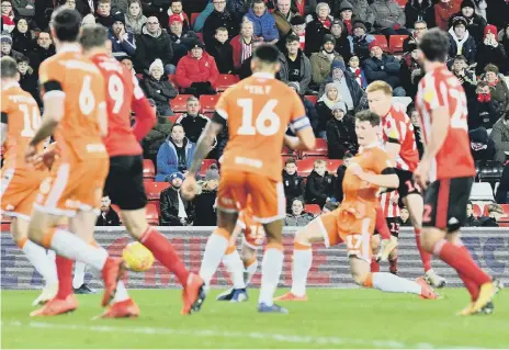  ??  ?? Duncan Watmore drives in a shot at the Stadium of Light.