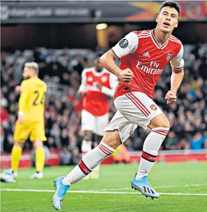  ??  ?? Quick work: Brazilian striker Gabriel Martinelli celebrates after scoring the opening goal for Arsenal after just 13 minutes