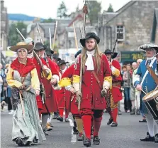  ??  ?? The procession was put together by the community-led Soldiers of Killiecran­kie re-enactment group.