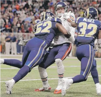  ?? | AP ?? Josh McCown is stopped short of the end zone by Rams linebacker Alec Ogletree (52) and cornerback Brandon McGee.