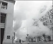  ?? AP/RICHARD DREW ?? Steam from a burst asbestos-lined pipe envelopes part of New York’s Fifth Avenue early Thursday.