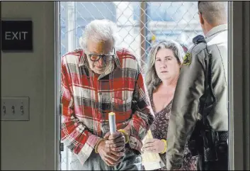  ?? Irfan Khan The Associated Press ?? Daniel Panico, 73, and Mona Kirk, 51, arrive Friday at a courtroom in Joshua Tree, Calif.