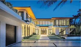  ??  ?? Hip-hop producer DJ Khaled paid $21.75 million US for a modern Miami Beach mansion that has five bedrooms and 12,750 square feet of living space.